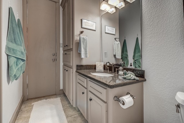 4216 Karankawa Way, Jamaica Beach, TX 77554 - bathroom with vanity, tile patterned floors, and a textured wall