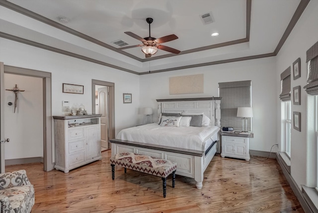 4216 Karankawa Way, Jamaica Beach, TX 77554 - bedroom featuring a raised ceiling, ornamental molding, light wood-style floors, a ceiling fan, and recessed lighting