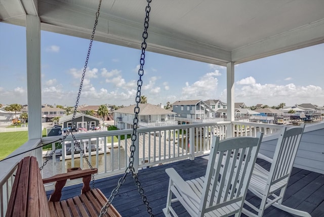 4216 Karankawa Way, Jamaica Beach, TX 77554 - wooden deck with a residential view and a water view