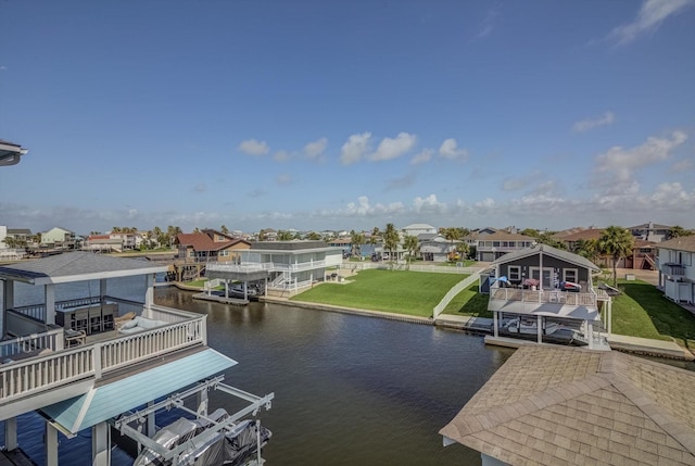 4216 Karankawa Way, Jamaica Beach, TX 77554 - dock with boat lift, a residential view, a water view, and a lawn