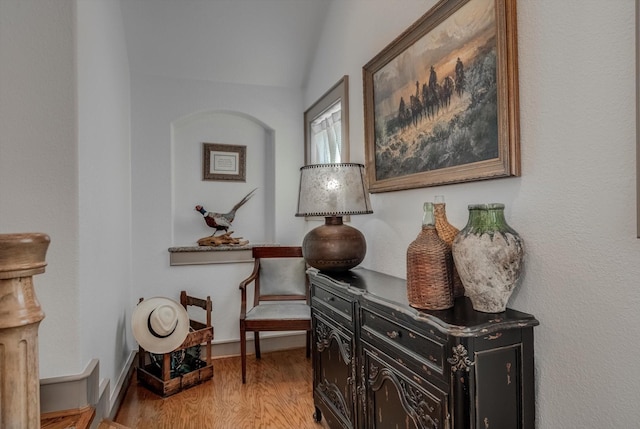 4216 Karankawa Way, Jamaica Beach, TX 77554 - sitting room featuring wood finished floors and vaulted ceiling