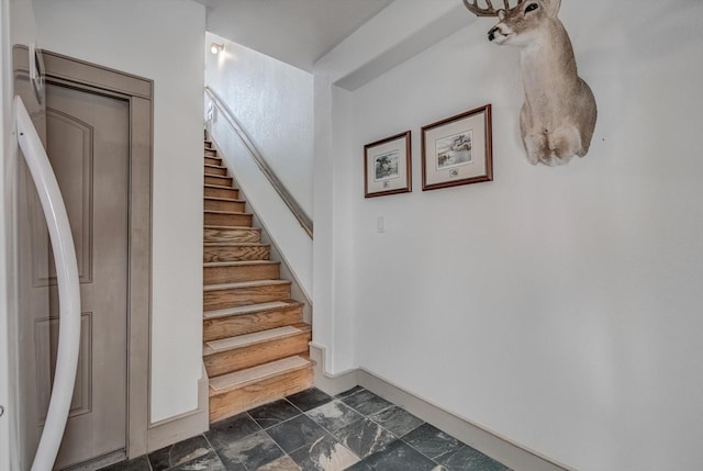 4216 Karankawa Way, Jamaica Beach, TX 77554 - stairway featuring baseboards and stone finish flooring