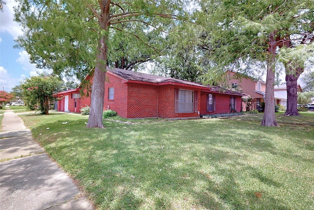 826 Kentucky St, Deer Park, TX 77536 - view of side of property with brick siding and a lawn