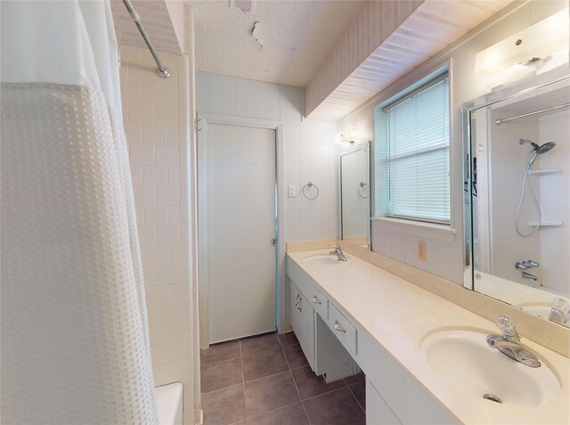 826 Kentucky St, Deer Park, TX 77536 - full bath with tile patterned floors, double vanity, and shower / bathtub combination with curtain
