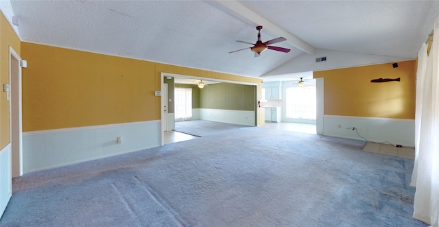 826 Kentucky St, Deer Park, TX 77536 - unfurnished room with a ceiling fan, wainscoting, plenty of natural light, and carpet