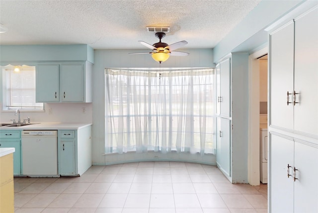 826 Kentucky St, Deer Park, TX 77536 - kitchen featuring dishwasher, ceiling fan, light countertops, a textured ceiling, and blue cabinetry