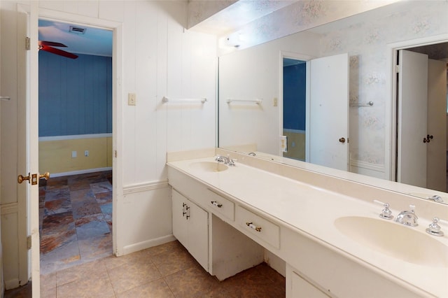 826 Kentucky St, Deer Park, TX 77536 - bathroom with double vanity, a ceiling fan, and stone finish floors