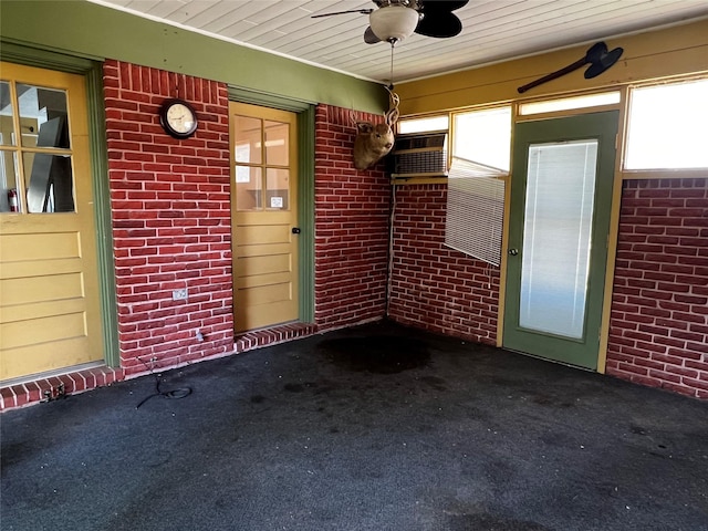 826 Kentucky St, Deer Park, TX 77536 - unfurnished sunroom with healthy amount of natural light, a ceiling fan, and a wall mounted air conditioner