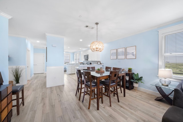 4121 Pointe W Dr Unit 301, Galveston, TX 77554 - dining room featuring ornamental molding, light wood-style floors, a chandelier, and recessed lighting