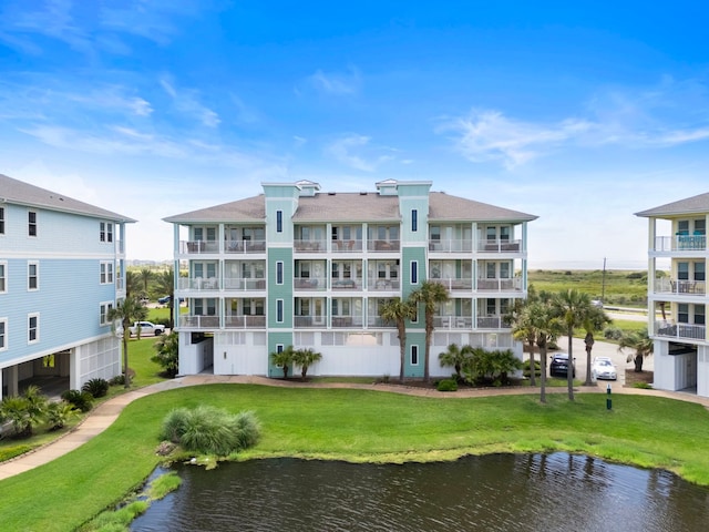 4121 Pointe W Dr Unit 301, Galveston, TX 77554 - view of apartment building / complex with a water view