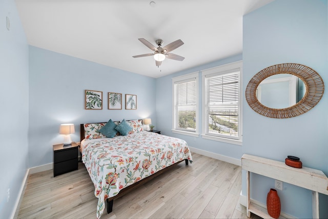 4121 Pointe W Dr Unit 301, Galveston, TX 77554 - bedroom featuring wood finished floors and ceiling fan