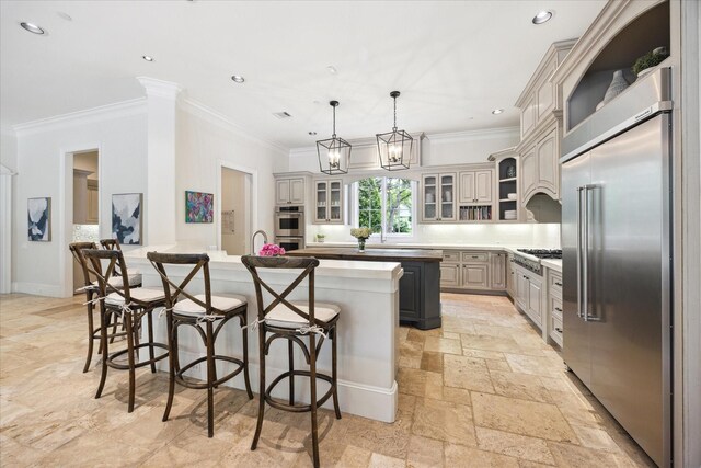 2 Hedwig Shadows Dr, Houston, TX 77024 - kitchen with stainless steel appliances, ornamental molding, a kitchen bar, a peninsula, and glass insert cabinets