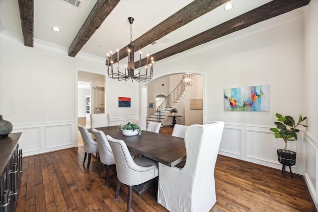 2 Hedwig Shadows Dr, Houston, TX 77024 - dining area featuring beamed ceiling, a decorative wall, dark wood-style flooring, arched walkways, and stairway