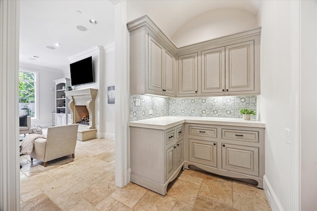 2 Hedwig Shadows Dr, Houston, TX 77024 - kitchen featuring cream cabinets, stone tile floors, tasteful backsplash, light countertops, and open floor plan