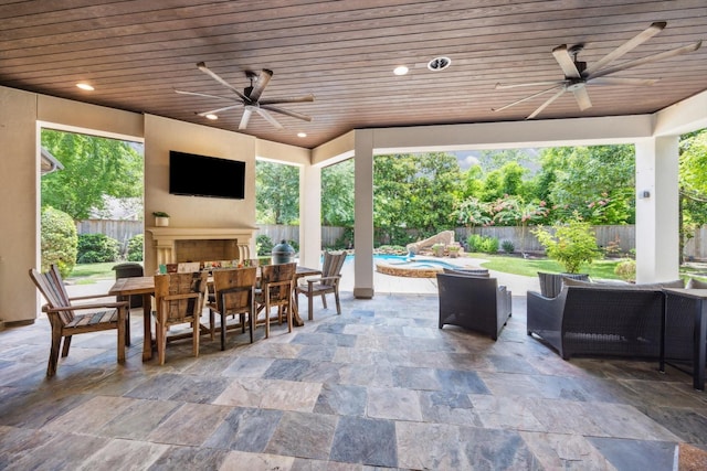 2 Hedwig Shadows Dr, Houston, TX 77024 - fenced backyard featuring ceiling fan, outdoor dining space, a patio area, and an outdoor living space with a fireplace