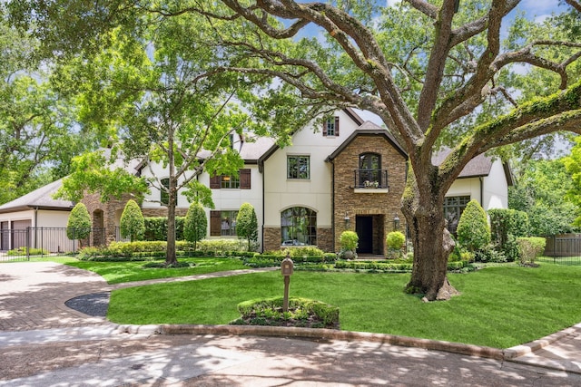 2 Hedwig Shadows Dr, Houston, TX 77024 - view of front of property with stone siding, stucco siding, and driveway