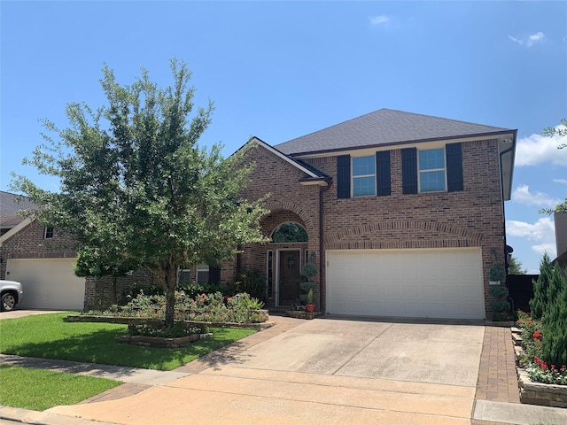 8927 Alcina Dr, Tomball, TX 77375 - traditional-style house featuring brick siding, driveway, and a garage