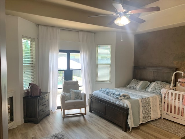 8927 Alcina Dr, Tomball, TX 77375 - bedroom featuring light wood-style flooring and a ceiling fan