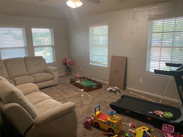 8927 Alcina Dr, Tomball, TX 77375 - carpeted living room featuring baseboards and a ceiling fan