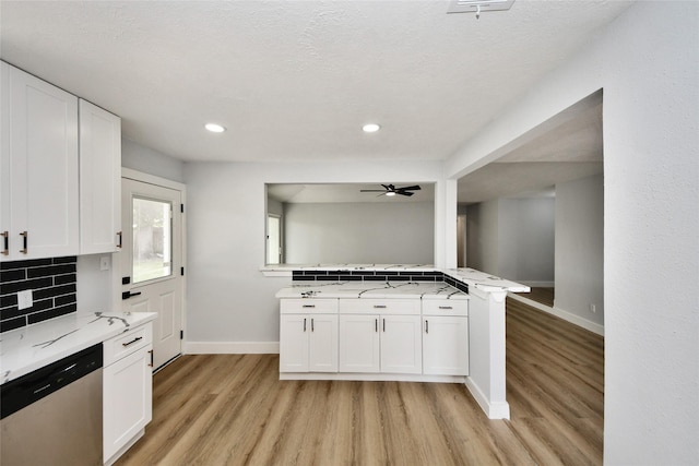 10415 Towne Oak Ln, Sugar Land, TX 77498 - kitchen with dishwasher, decorative backsplash, light wood-type flooring, white cabinetry, and recessed lighting