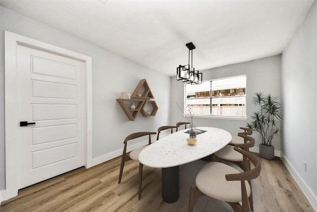 10415 Towne Oak Ln, Sugar Land, TX 77498 - dining room featuring light wood-style flooring and baseboards