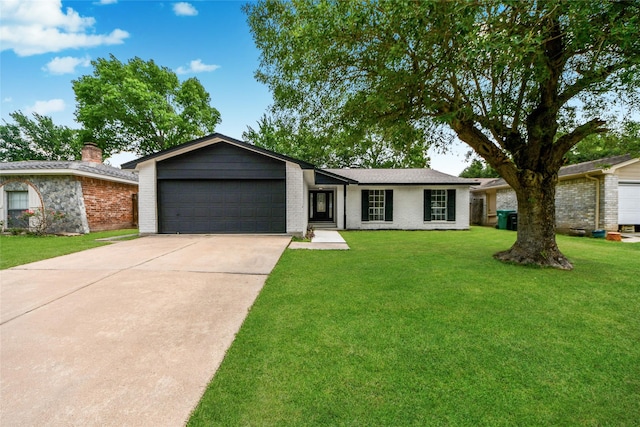 10415 Towne Oak Ln, Sugar Land, TX 77498 - view of front of home with driveway, a garage, a front lawn, and brick siding