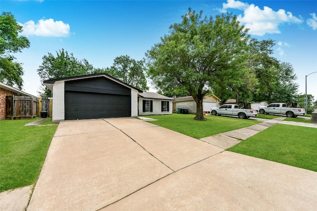 10415 Towne Oak Ln, Sugar Land, TX 77498 - view of front of house with brick siding, driveway, and a garage