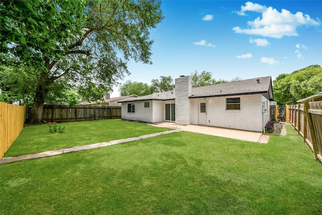 10415 Towne Oak Ln, Sugar Land, TX 77498 - rear view of property featuring a chimney, brick siding, a patio, and a fenced backyard