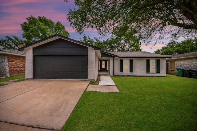 10415 Towne Oak Ln, Sugar Land, TX 77498 - view of front of property featuring concrete driveway, brick siding, a front yard, and a garage