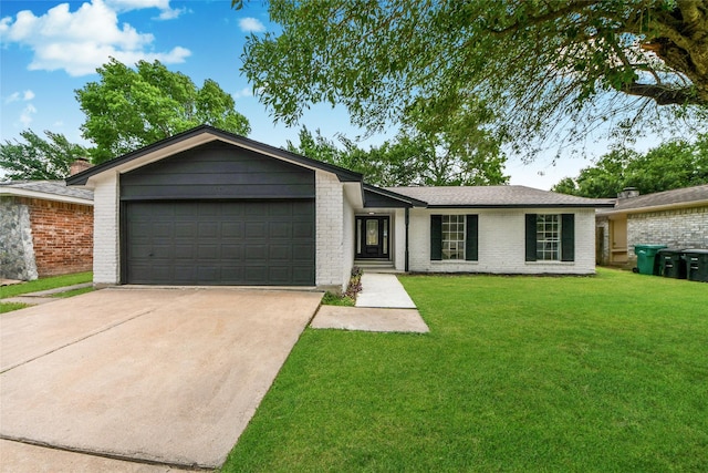 10415 Towne Oak Ln, Sugar Land, TX 77498 - view of front facade featuring concrete driveway, brick siding, a front lawn, and an attached garage