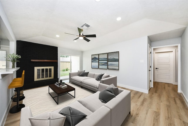 10415 Towne Oak Ln, Sugar Land, TX 77498 - living area with lofted ceiling, a ceiling fan, light wood-style flooring, a fireplace, and recessed lighting
