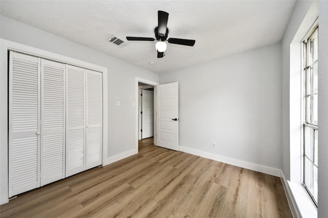10415 Towne Oak Ln, Sugar Land, TX 77498 - unfurnished bedroom featuring wood finished floors, a closet, and ceiling fan