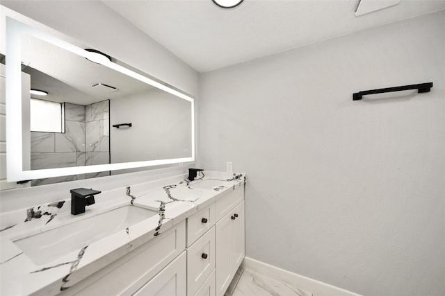 10415 Towne Oak Ln, Sugar Land, TX 77498 - bathroom featuring marble finish floors, double vanity, and a tile shower