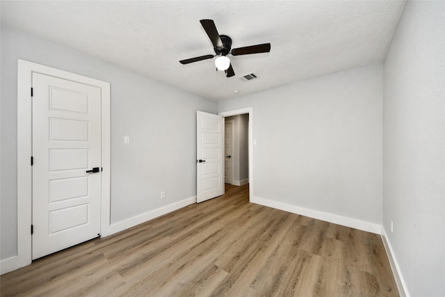 10415 Towne Oak Ln, Sugar Land, TX 77498 - unfurnished bedroom with light wood-type flooring and a ceiling fan