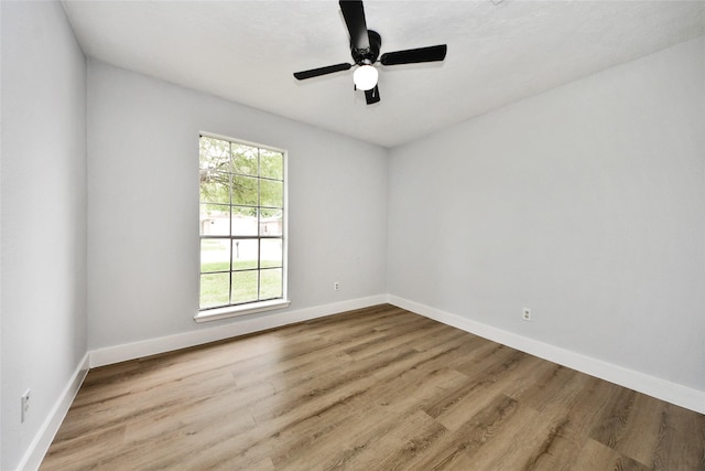 10415 Towne Oak Ln, Sugar Land, TX 77498 - unfurnished room featuring wood finished floors and baseboards