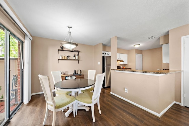 2211 S Kirkwood Rd Unit 23, Houston, TX 77077 - dining space with dark wood-style floors