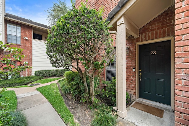 2211 S Kirkwood Rd Unit 23, Houston, TX 77077 - doorway to property with brick siding