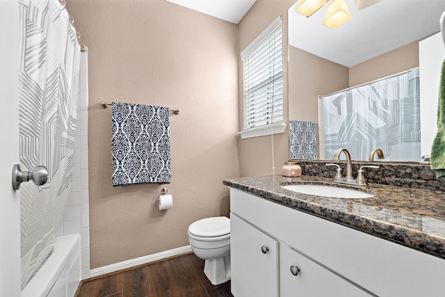 2211 S Kirkwood Rd Unit 23, Houston, TX 77077 - full bathroom featuring wood finished floors, vanity, and shower / bathtub combination with curtain