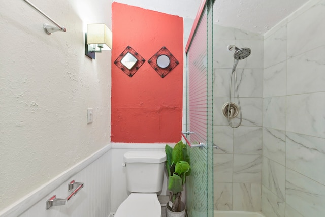 315 E Adoue St, Baytown, TX 77520 - bathroom featuring a stall shower and a wainscoted wall