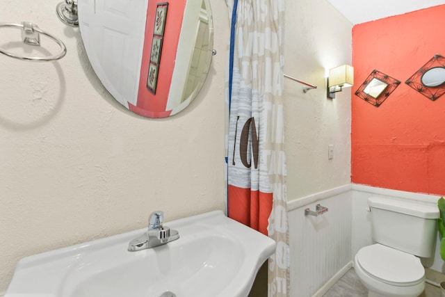 315 E Adoue St, Baytown, TX 77520 - bathroom featuring a sink and wainscoting