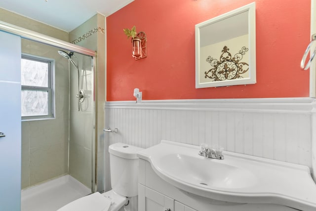 315 E Adoue St, Baytown, TX 77520 - bathroom featuring a wainscoted wall, a stall shower, and vanity