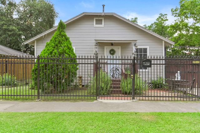 315 E Adoue St, Baytown, TX 77520 - bungalow-style house featuring a gate and a fenced front yard