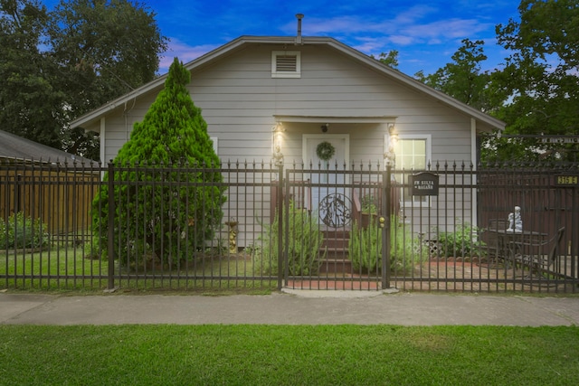 315 E Adoue St, Baytown, TX 77520 - bungalow-style home featuring a gate