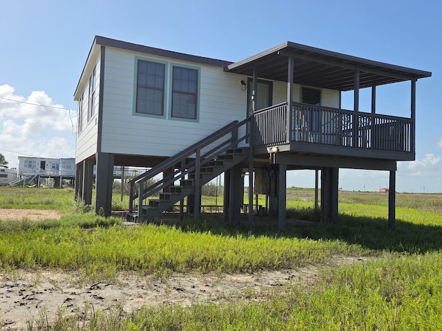 714 Caisson St, Surfside Beach, TX 77541 - rear view of house with stairway
