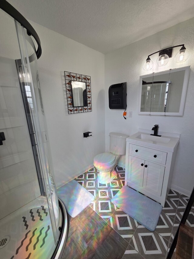 714 Caisson St, Surfside Beach, TX 77541 - bathroom featuring a stall shower, vanity, and a textured ceiling