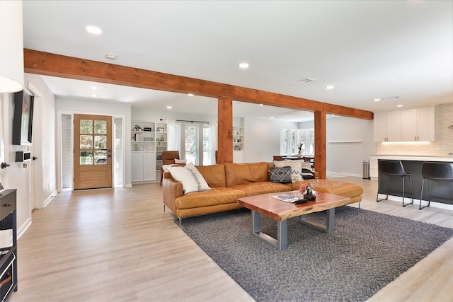 1711 Mossy Stone Dr, Houston, TX 77077 - living area with light wood-style floors, recessed lighting, and beam ceiling