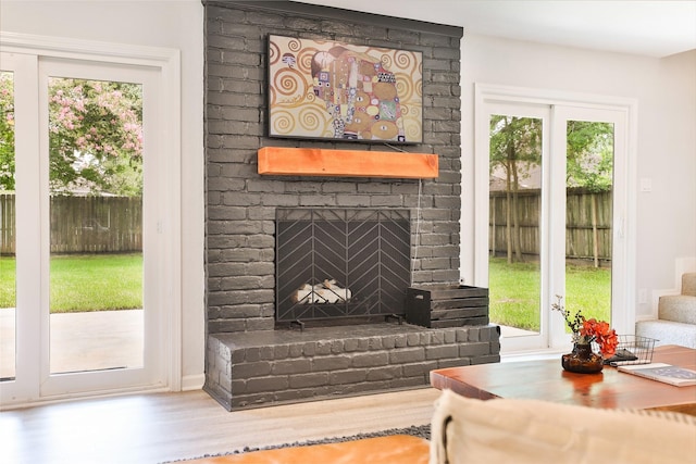 1711 Mossy Stone Dr, Houston, TX 77077 - living area with a fireplace and wood finished floors