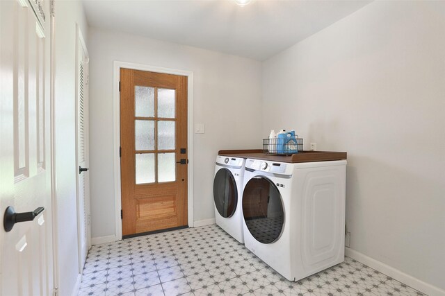 1711 Mossy Stone Dr, Houston, TX 77077 - laundry area with separate washer and dryer and light floors