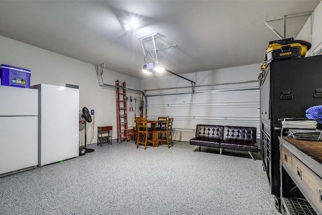 18534 Ariat Dr, Cypress, TX 77429 - garage with freestanding refrigerator and a garage door opener