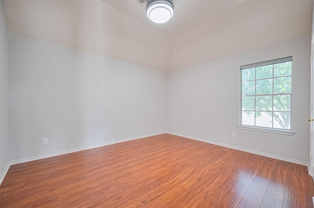3402 Santa Catalina Ct, Katy, TX 77450 - spare room featuring light wood-style floors and lofted ceiling